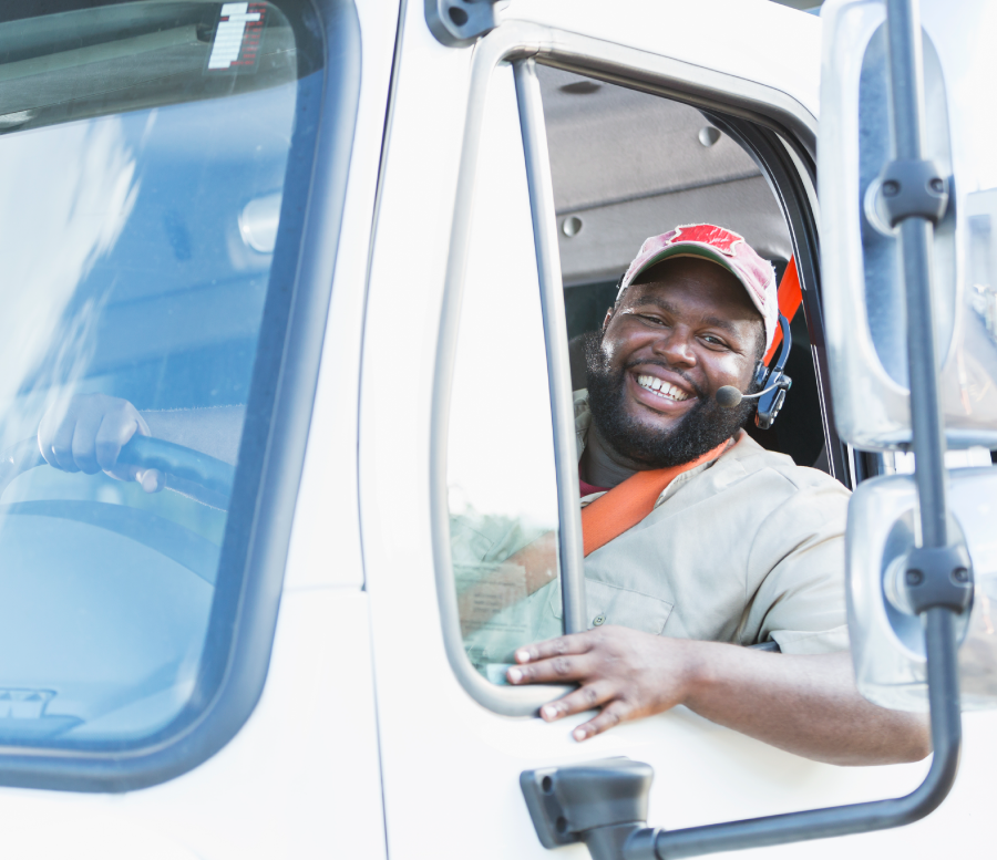 Happy truck driver hauling a load